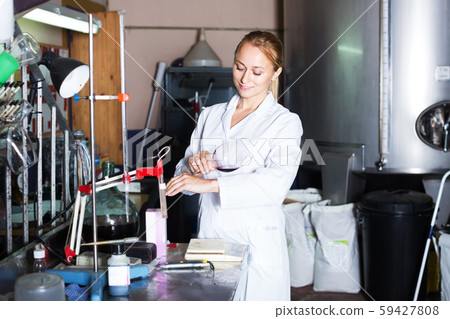 Winery technician in laboratory Winery technician in laboratory 59427808