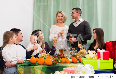 Children, grandparents and parents togethe congratulating Children, grandparents and parents togethe congratulating 59428017