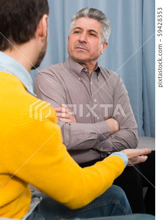 Adult father and son solve problems Adult father and son solve problems 59428353