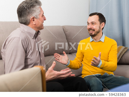 Adult father and son friendly conversation Adult father and son friendly conversation 59428363