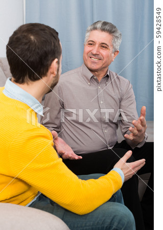 Adult father and son friendly conversation Adult father and son friendly conversation 59428549
