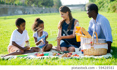 Parents with daughter and son at picnic Parents with daughter and son at picnic 59428581