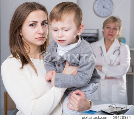 Woman is dissatisfied of medical examinaing of her son Woman is dissatisfied of medical examinaing of her son 59428584