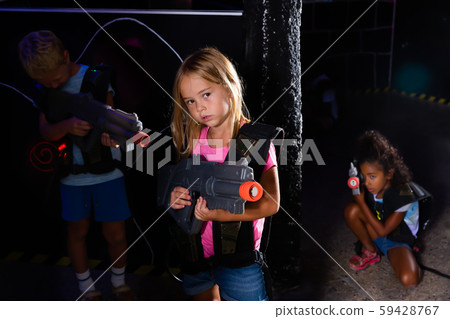 Glad tweenager girl with laser gun Glad tweenager girl with laser gun 59428767