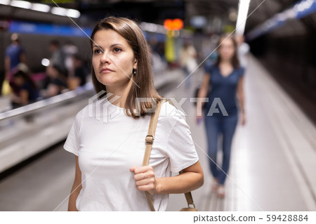 Attractive woman waiting for the subway train 59428884
