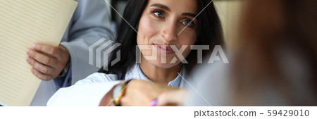 Beautiful smiling female GP shaking hands with visitor Beautiful smiling female GP shaking hands with visitor 59429010