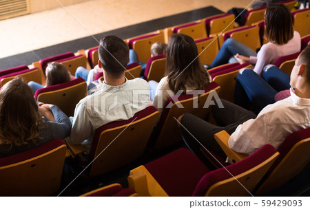 Young audience expecting movie to begin Young audience expecting movie to begin 59429093