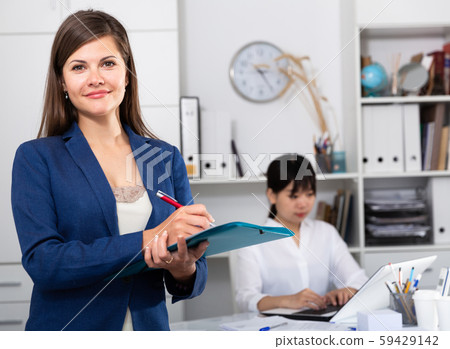 Portrait of successful confident business woman in office interior Portrait of successful confident business woman in office interior 59429142