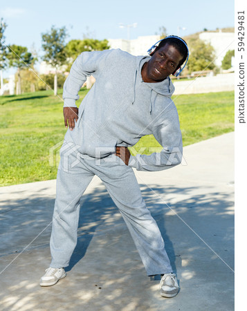 Active african american man doing workout in park at sunny day Active african american man doing workout in park at sunny day 59429481