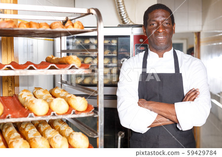 Confident baker near professional bread oven Confident baker near professional bread oven 59429784