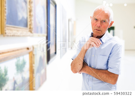 Man observing painting gallery 59430322