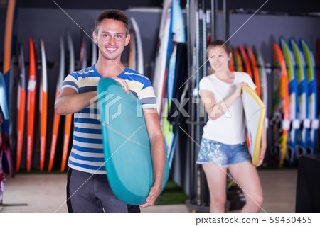 Full length portrait of smiling guy with surfboard Full length portrait of smiling guy with surfboard 59430455