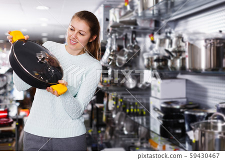 female is buying new stewpot 59430467