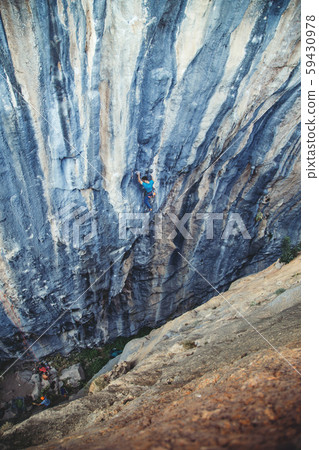 Man climbing a rock. Man climbing a rock. 59430978