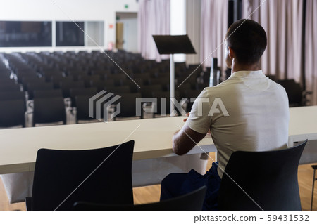 Man on stage opposite to empty hall 59431532