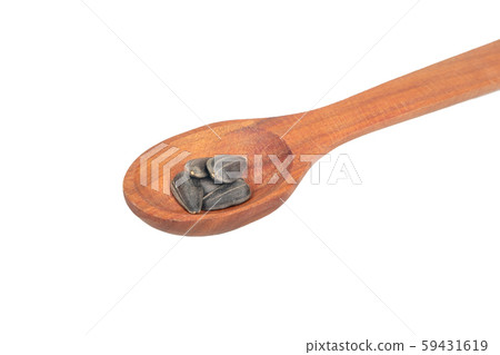 Sunflower seeds in a spoon Sunflower seeds in a spoon 59431619