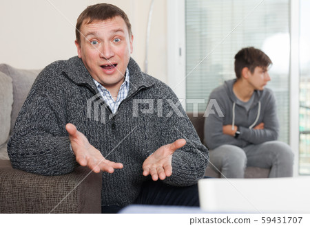 Outraged father unhappy with his son teenager Outraged father unhappy with his son teenager 59431707