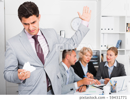 Angry manager dissatisfied with colleagues 59431771