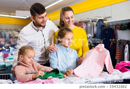 Family buying children clothes Family buying children clothes 59432862