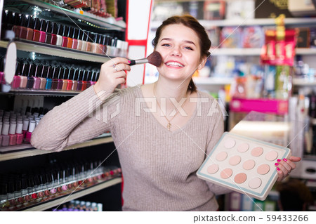 Young girl client is searching for reliable compact powder Young girl client is searching for reliable compact powder 59433266