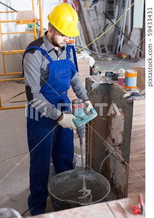Plasterer is ready to plaster the walls at the object. Plasterer is ready to plaster the walls at the object. 59433431