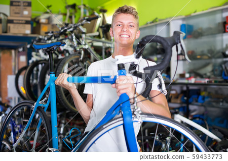 customer holding bicycle in the hand customer holding bicycle in the hand 59433773