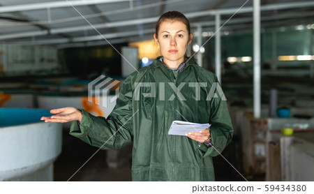 Woman at trout breeding incubator Woman at trout breeding incubator 59434380