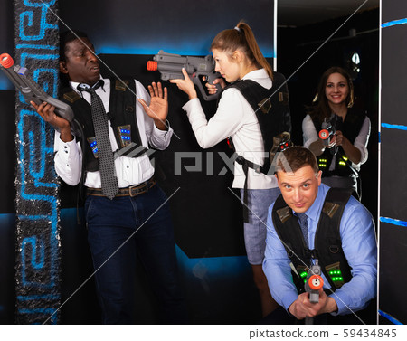 men and women co-workers having corporate entertainment 59434845