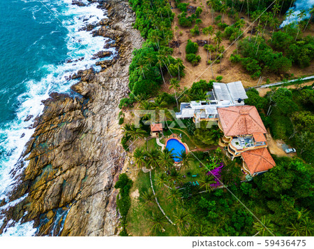 Luxurious hotel with a swimming pool at evening Sri Lanka, Drone photo. Luxurious hotel with a swimming pool at evening Sri Lanka, Drone photo. 59436475