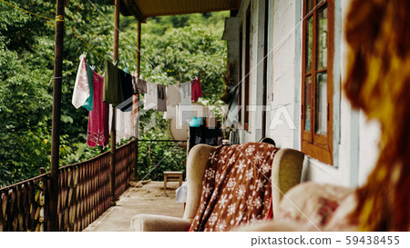 Clothes drying on rope line on a balcony - rural life Clothes drying on rope line on a balcony - rural life 59438455