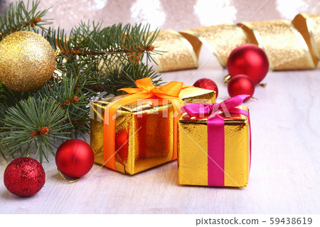 Christmas decoration with gift boxes, colorful christmas balls and christmas tree on a blurry Christmas decoration with gift boxes, colorful christmas balls and christmas tree on a blurry 59438619