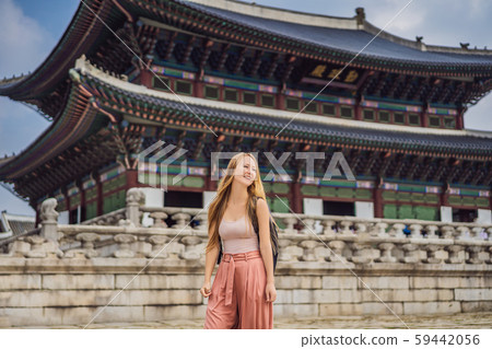 Woman tourist in korea. Gyeongbokgung Palace grounds in Seoul, South Korea. Travel to Korea concept Woman tourist in korea. Gyeongbokgung Palace grounds in Seoul, South Korea. Travel to Korea concept 59442056