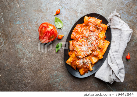 Pasta paccheri with tomato sauce 59442844