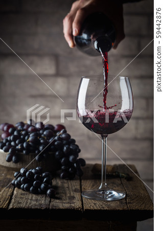 Pouring red wine Pouring red wine 59442876