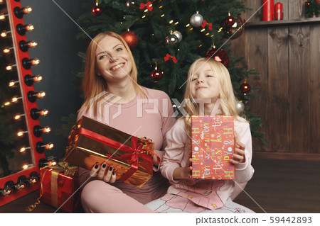 happy family mother and baby little daughter playing in the winter for the Christmas holidays happy family mother and baby little daughter playing in the winter for the Christmas holidays 59442893