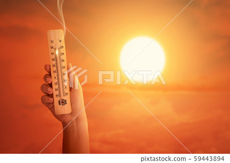 Hand holding the thermometer with high temperature on the air 59443894
