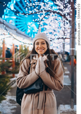 Girl posing against the background of decorated trees Girl posing against the background of decorated trees 59444259