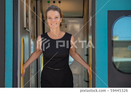 young woman with luggage take the express train from the main station 59445326