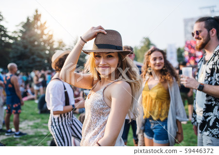 Group of young friends at summer festival. 59446372