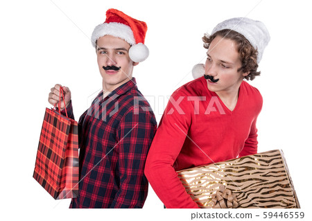 Two funny young men celebrating christmas isolated 59446559
