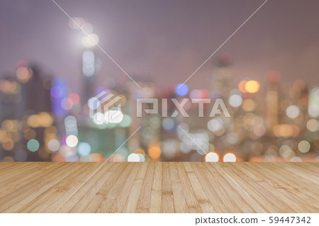 Wood floor terrace or wooden table with blur background rooftop perspective view city night light bokeh background of cityscape. 59447342
