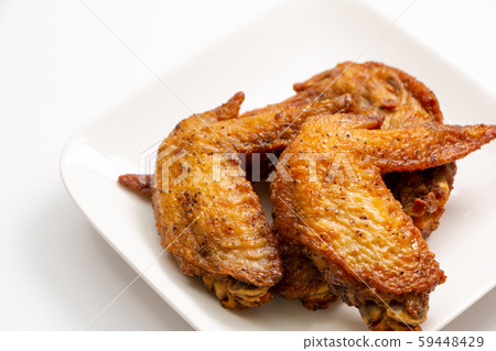 Fried chicken wings. (White plate, white background) Fried chicken wings. (White plate, white background) 59448429