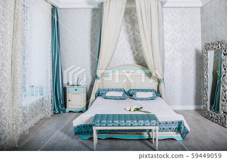 Stylish loft cozy bedroom wooden bed with clean linen bedding. Modern interior 59449059