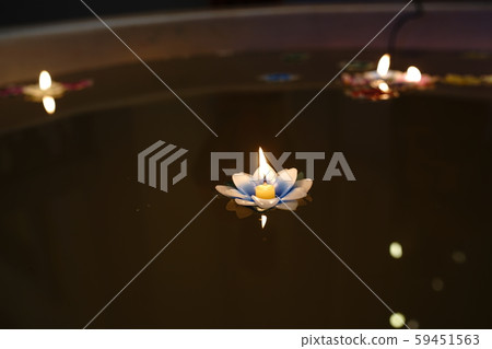 Thai Loi Krathong tradition uses materials made from candles floating in the water. Thai Loi Krathong tradition uses materials made from candles floating in the water. 59451563