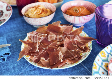 serrano ham on a colorful set table serrano ham on a colorful set table 59451634