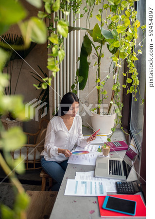 Dark-haired businesswoman working in design industry working hard Dark-haired businesswoman working in design industry working hard 59454097