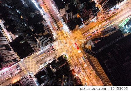 Car, taxi, and bus traffic on road intersection at night in Hong Kong downtown district, drone aerial top view. Street commuter, Asia city life, or public transportation concept Car, taxi, and bus traffic on road intersection at night in Hong Kong downtown district, drone aerial top view. Street commuter, Asia city life, or public transportation concept 59455095