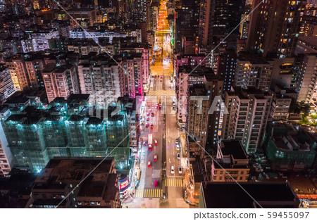 Car, taxi, and bus traffic on road intersection at night in Hong Kong downtown district, drone aerial top view. Street commuter, Asia city life, or public transportation concept Car, taxi, and bus traffic on road intersection at night in Hong Kong downtown district, drone aerial top view. Street commuter, Asia city life, or public transportation concept 59455097