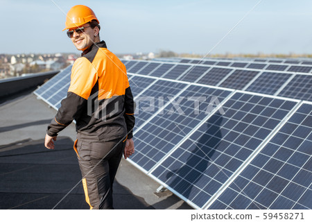 Well-equipped workman on a solar station Well-equipped workman on a solar station 59458271
