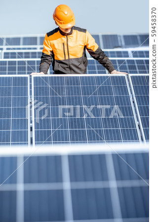 Workman on the solar station 59458370